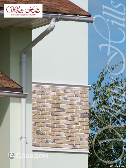 Фасад частного дома с применением облицовочного камня White Hills Бремен брик 305-10